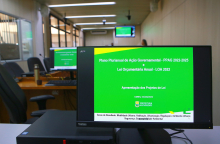 Tela de computador com fundo verde identificando a apresentação do PPAG e da LOA
